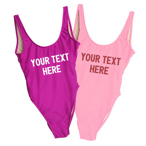 A fuchsia and a pink swimsuit are customized with text that reads "your text here" 