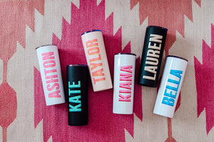 A few tumblers are customized with names in different fonts and colors.