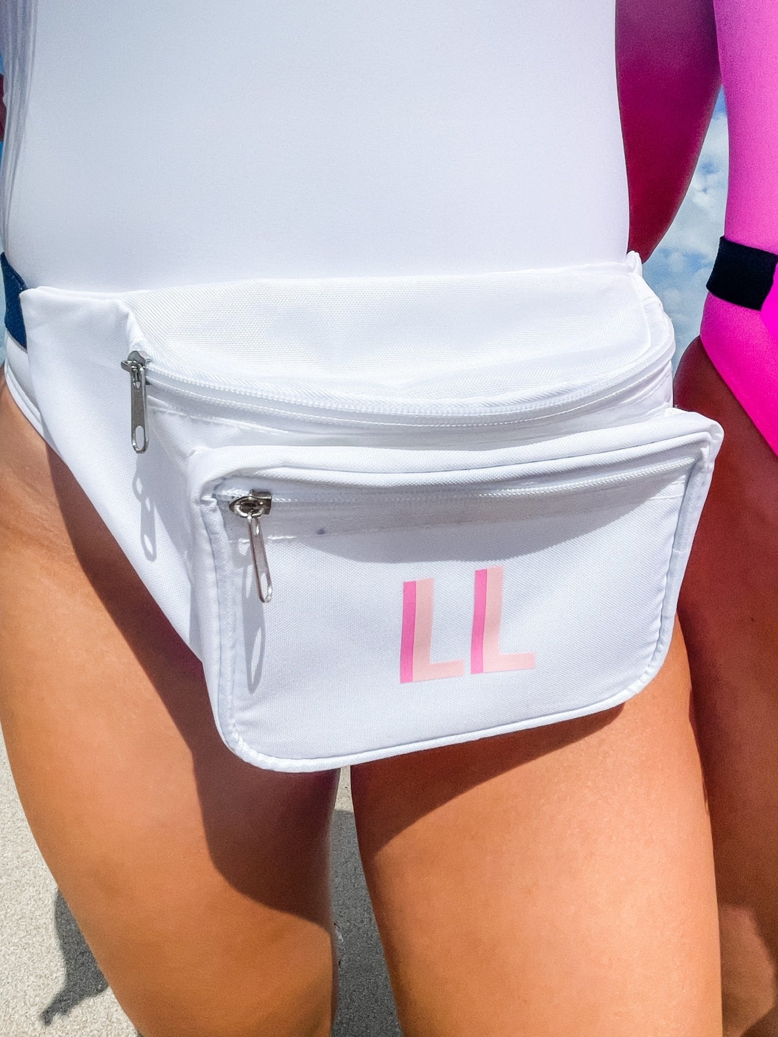 A group of fanny packs are customized with monograms