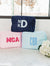 A group of a extra large nylon pouches are customized with embroidered monograms and names