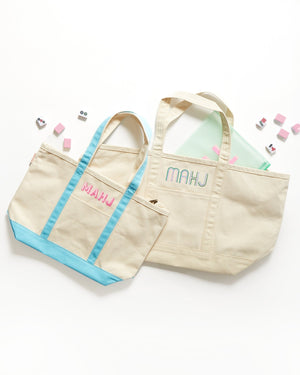 Embroidered mahjong canvas tote bag styled with matching accessories