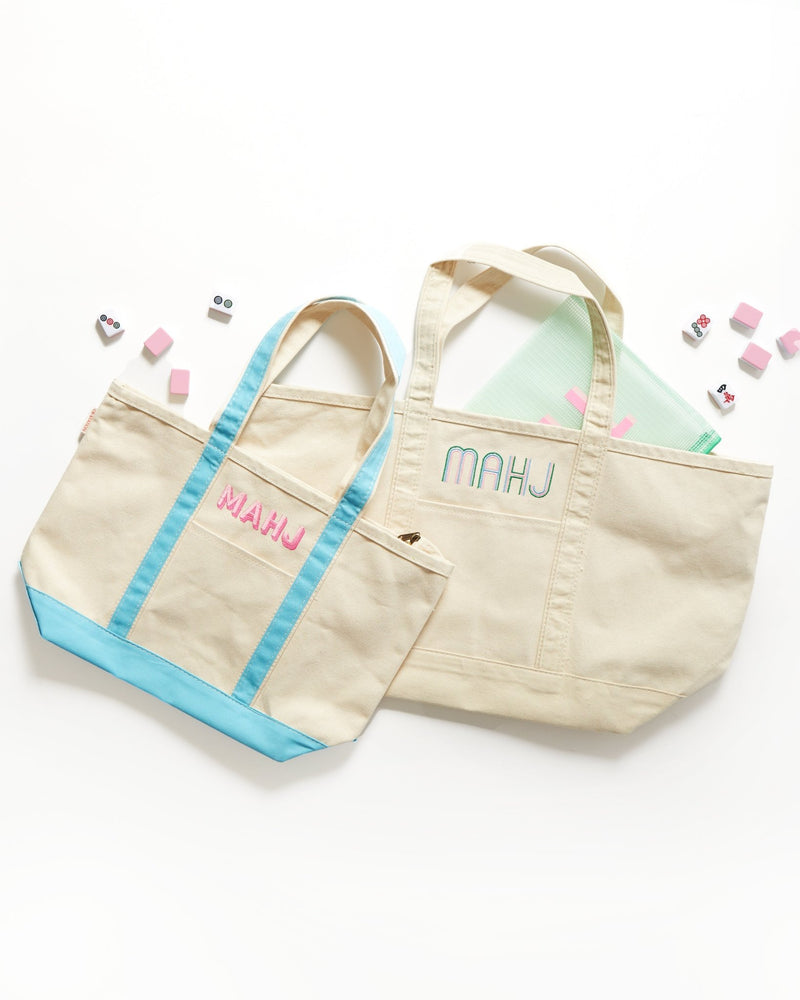 Embroidered mahjong canvas tote bag styled with matching accessories