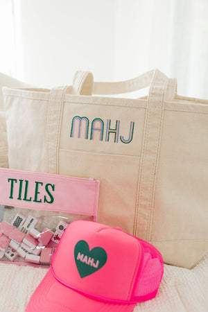 Embroidered mahjong canvas tote bag styled with matching accessories