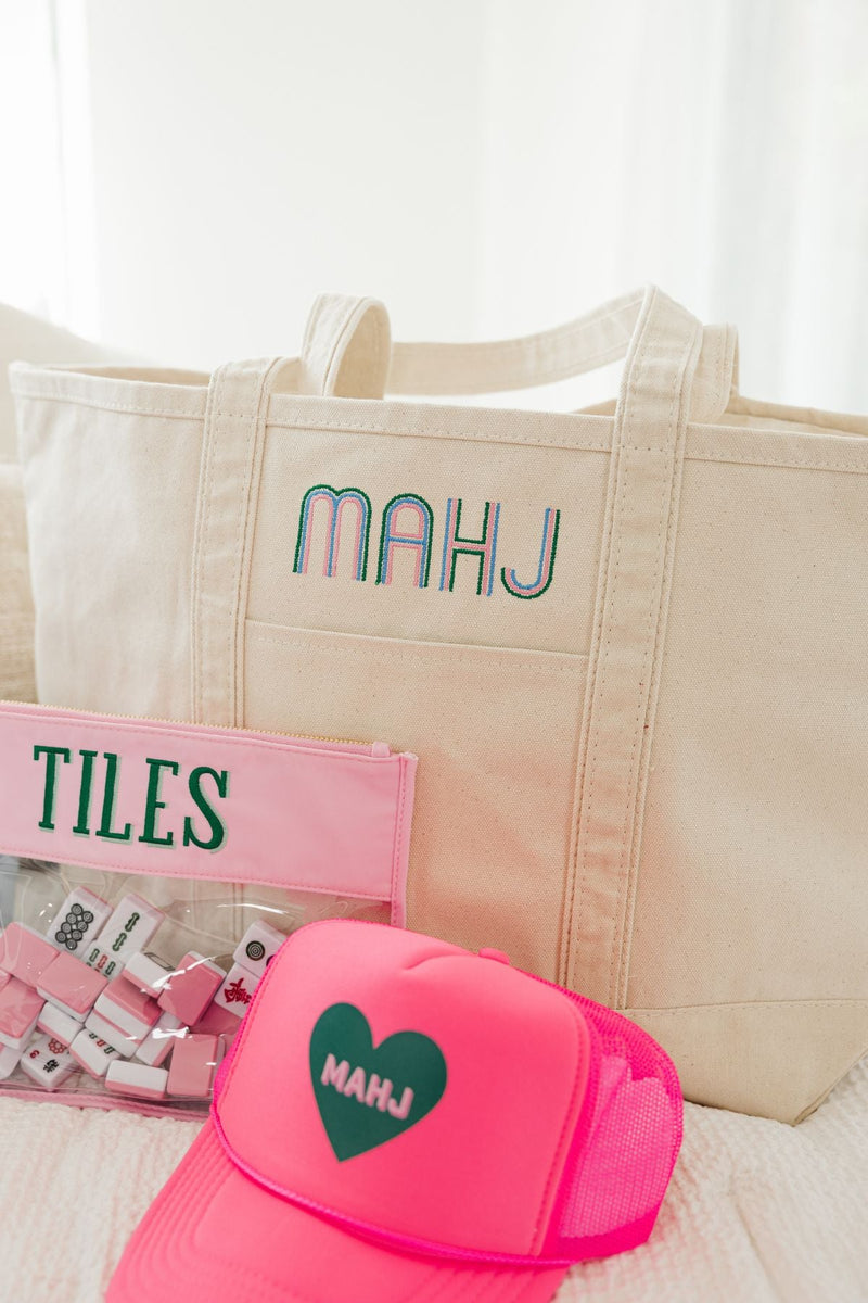 Embroidered mahjong canvas tote bag styled with matching accessories