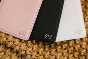Custom luggage tag featuring gold foil monogram, personalized travel tag