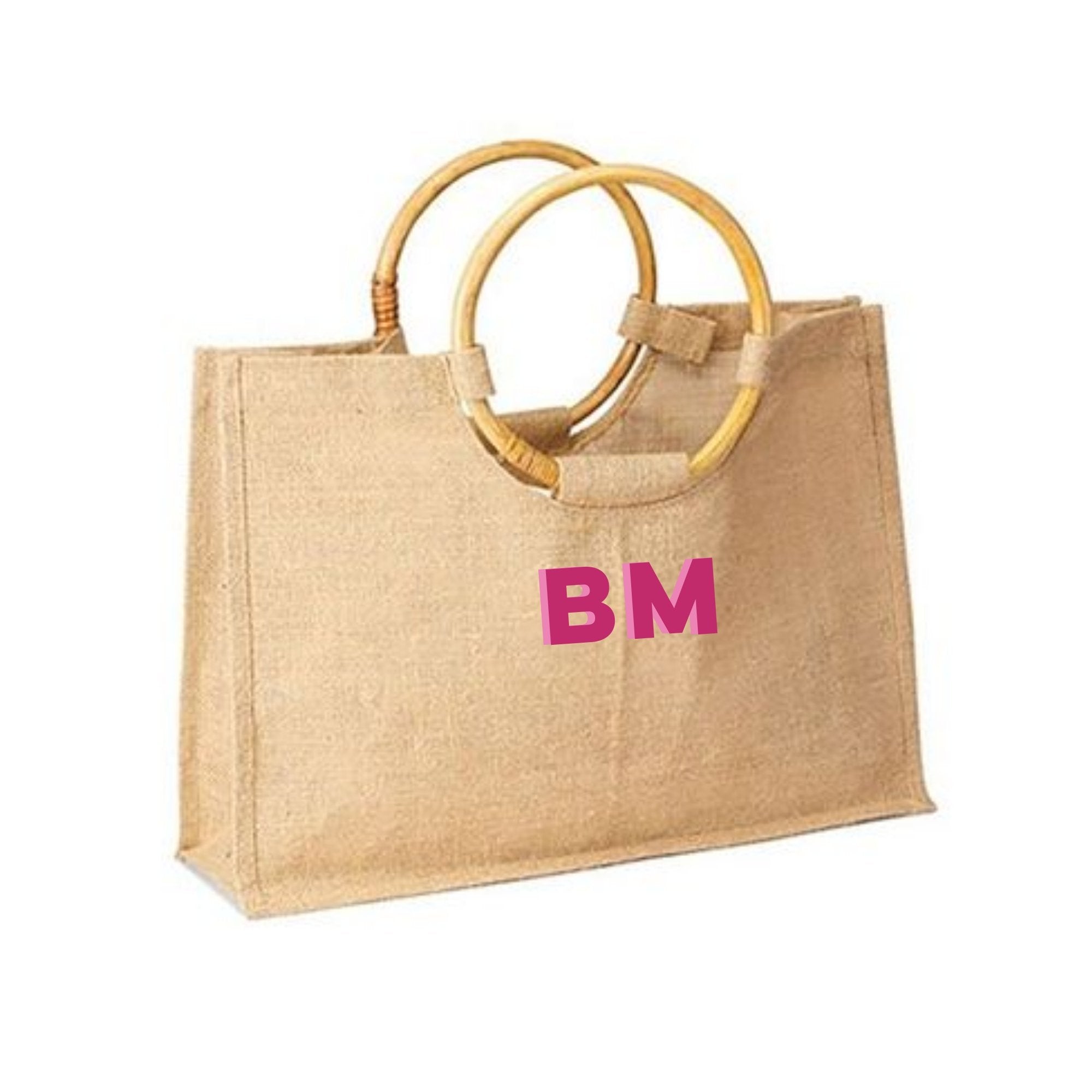 A bamboo jute is customized with a pink monogram 