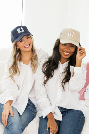 Shadow monogram trucker hat worn by women, personalized embroidered initials, casual everyday style