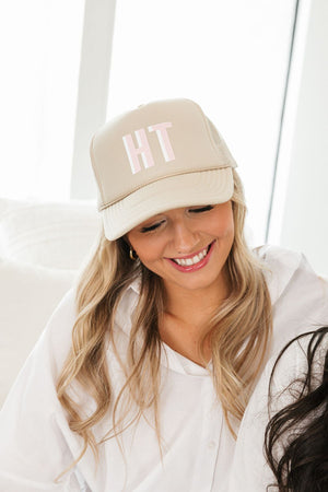 Personalized shadow monogram trucker hat in neutral color, embroidered initials on front panel