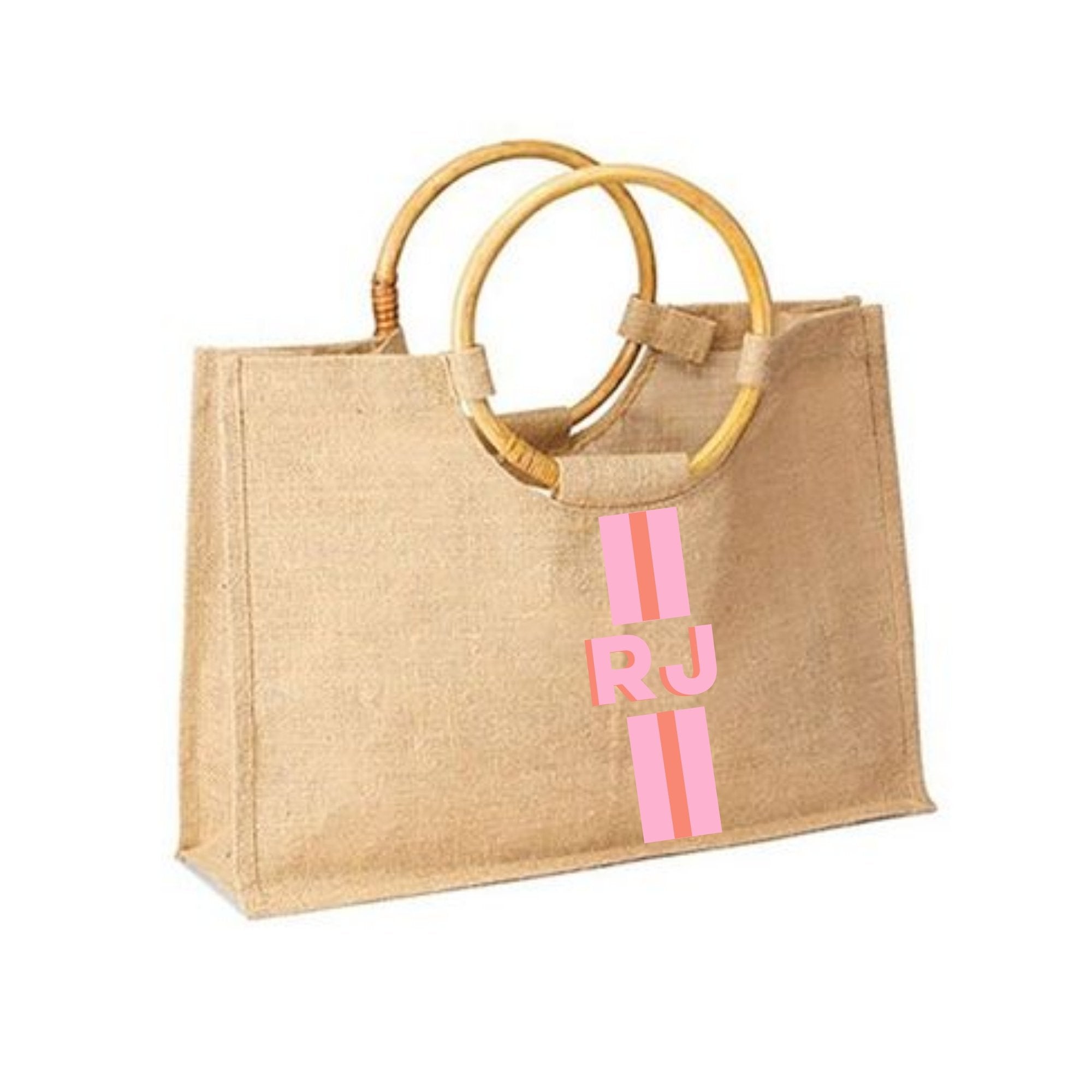 A bamboo jute bag is customized with a pink and melon stripe and monogram 