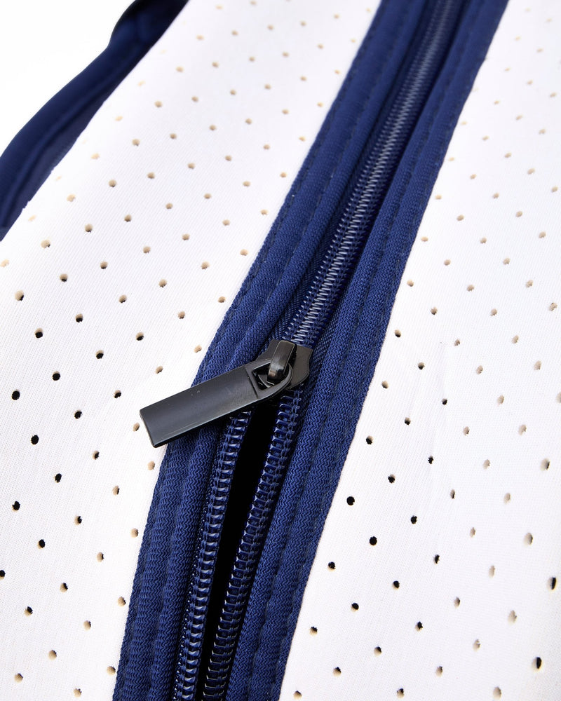 A pickleball bag is zipped up with a black zipper