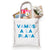A tote bag filled with magazines and flowers is customized with the phrase "Vamos A La Playa" in pink and red.