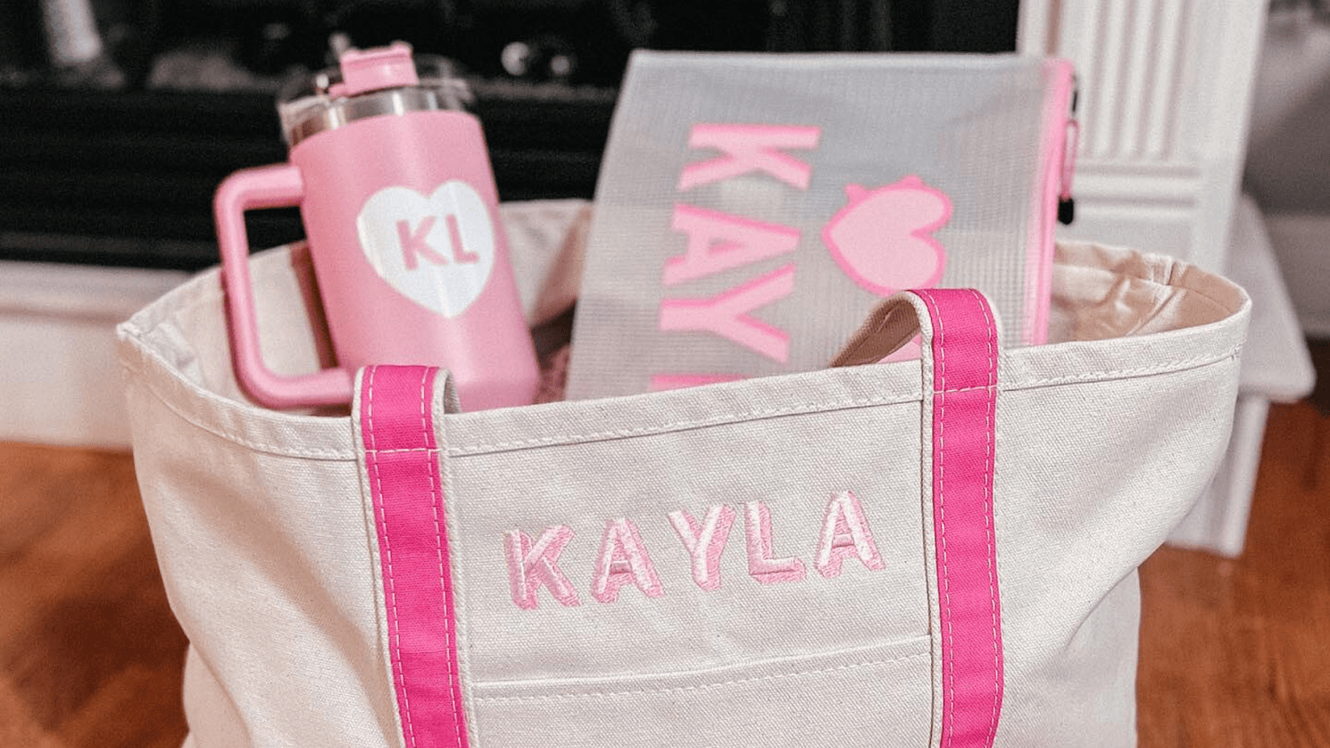 Sprinkled With Pink’s monogrammed tote stuffed with a matching pink tumbler and pool pouch