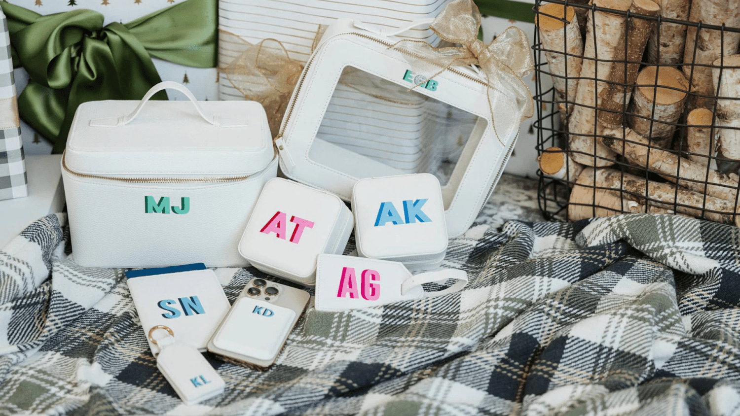 An assortment of Sprinkled With Pink’s monogrammed travel pouches, tags, and bags.