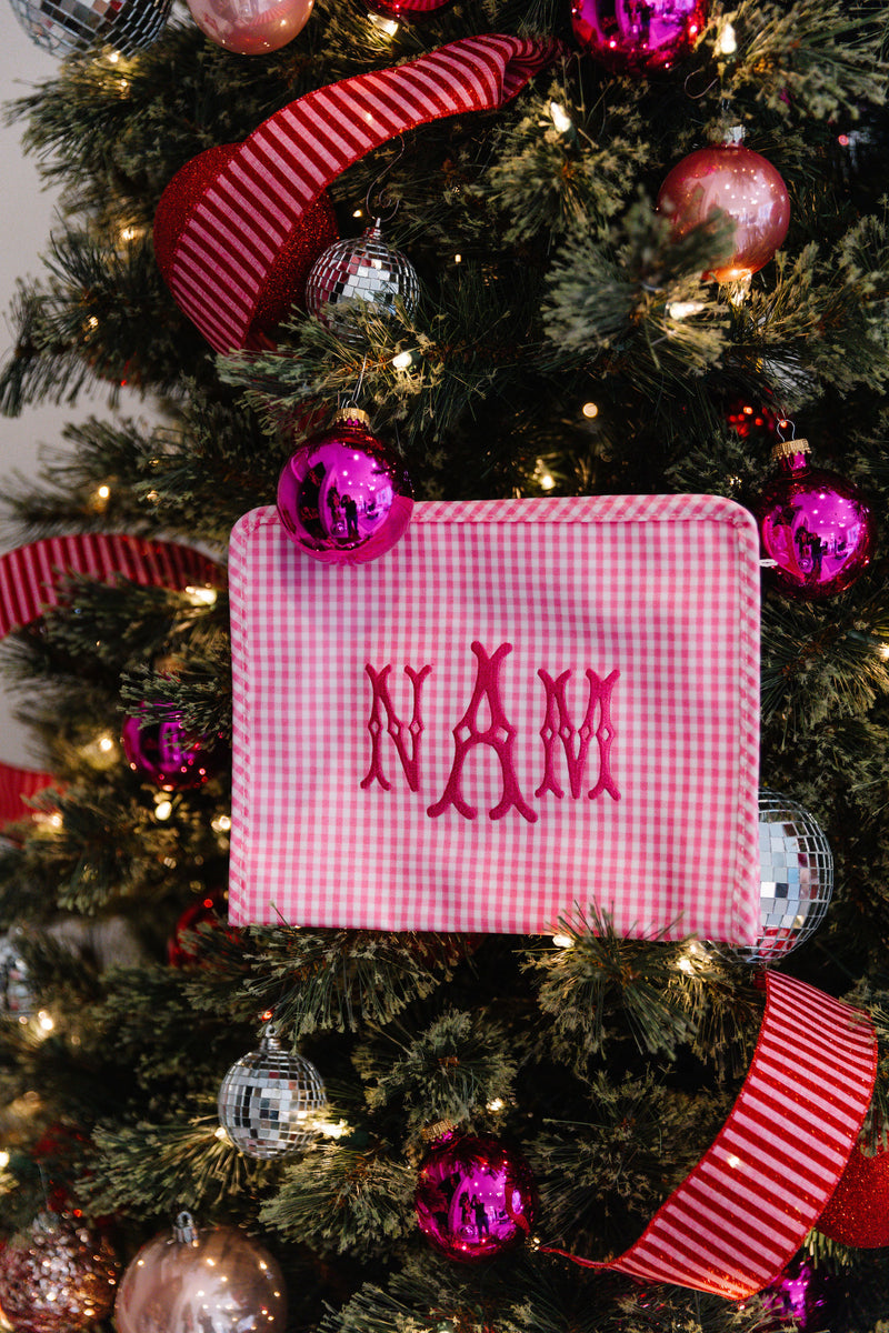 Monogrammed TRVL Roadie bag hanging on Christmas tree, festive personalized gift by Sprinkled With Pink