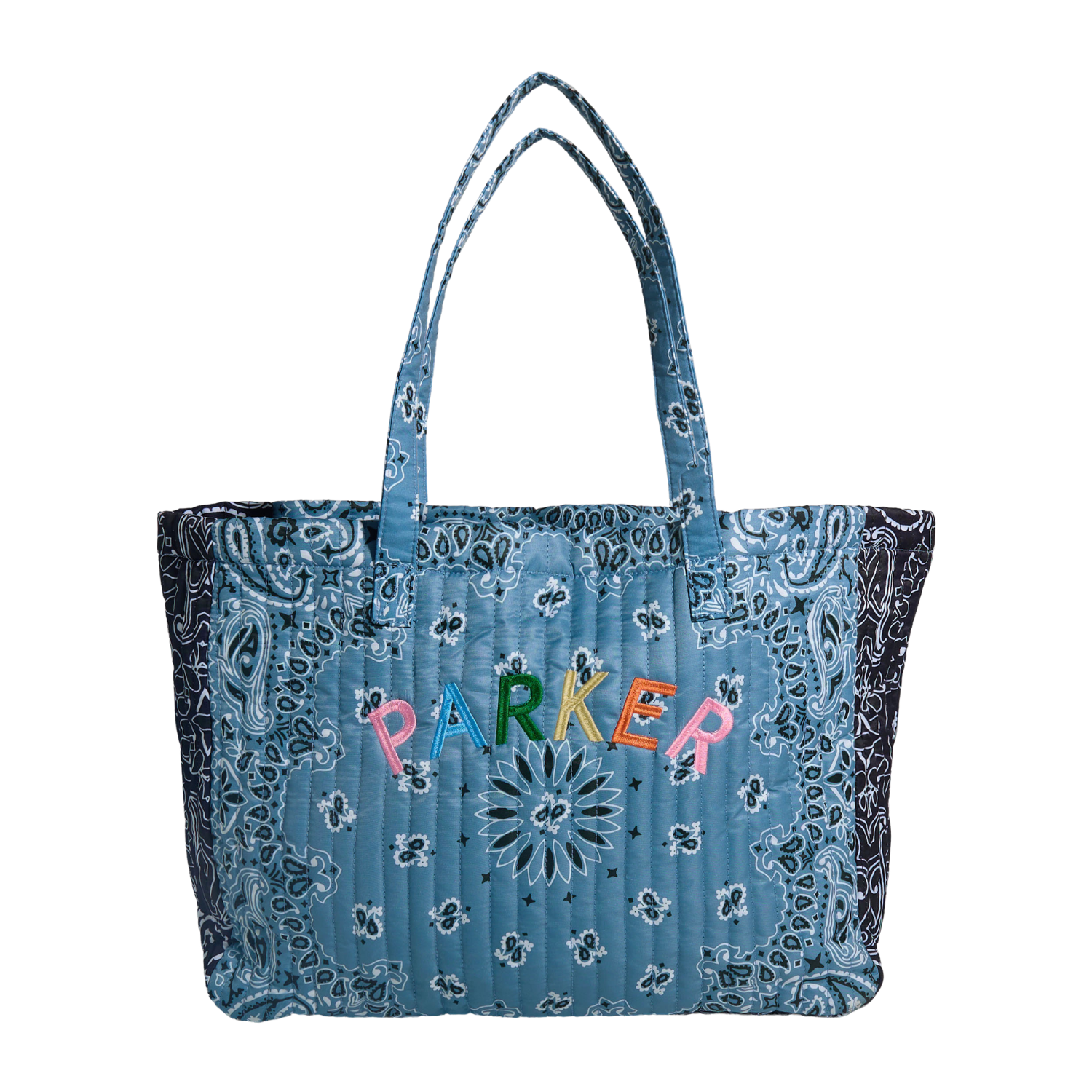A quilted blue bandana tote bag with black paisley borders, featuring the word 'PARKER' embroidered in colorful letters across the front.
