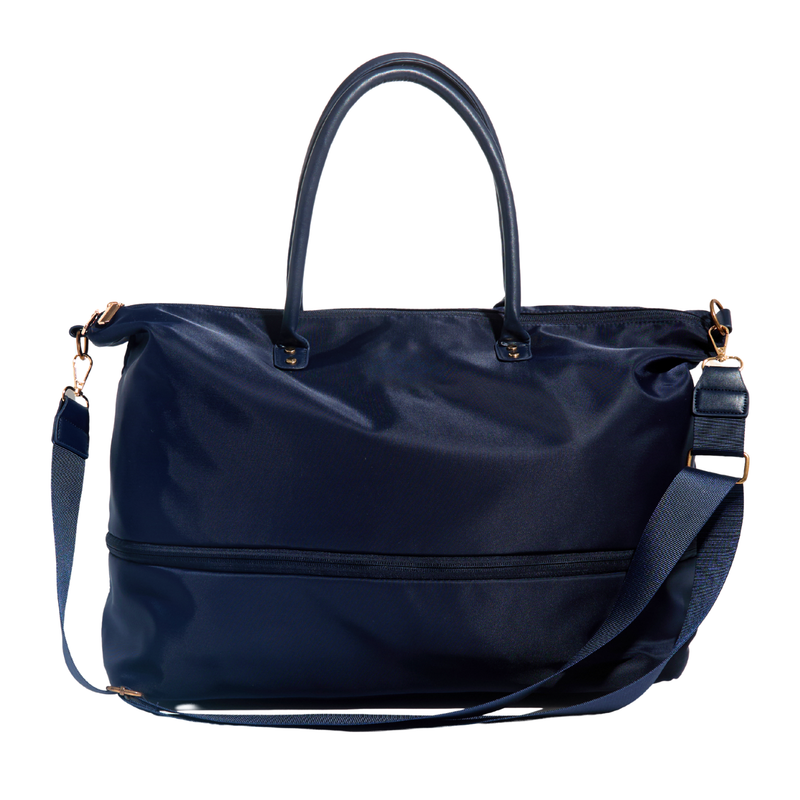 A navy blue nylon tote bag with dual top handles, a detachable shoulder strap, and gold-tone hardware, shown against a plain white background.