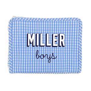 Light blue gingham TRVL Roadie pouch embroidered 'Miller boys' in navy block and script lettering, on a white background.
