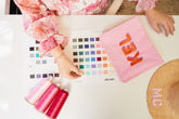 Employee picking out threads and color swatches for product
