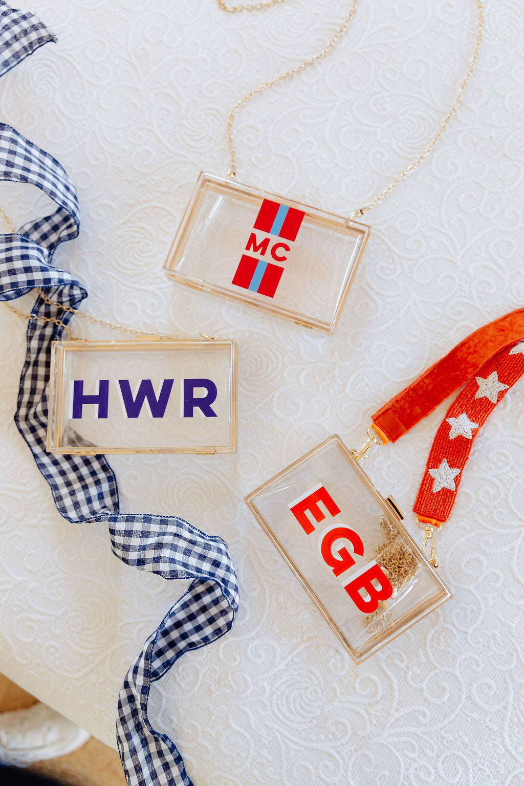 Clear stadium bag with gold chain and red-blue “RDL” shadow monogram – Shadow Monogram Stadium Bag