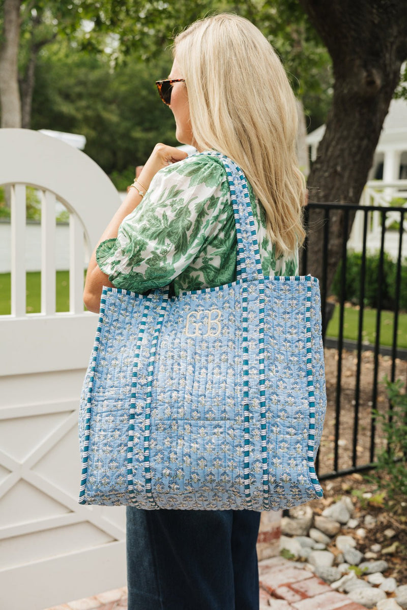 Personalized Block Print Tote bag in blue floral print, styled with embroidered initials.
