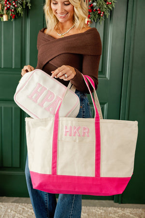 Woman holding two-tone personalized canvas tote with initials, everyday style.