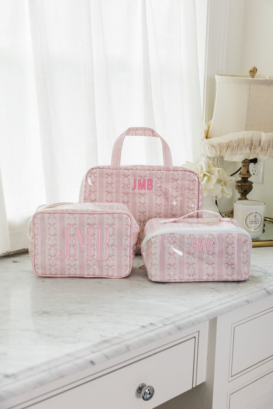 Blue floral clear coated essential set with monogram HKR, includes tote, pouch, and flat case.