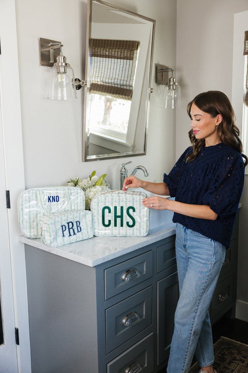 Woman with personalized clear coated extra large pouch.