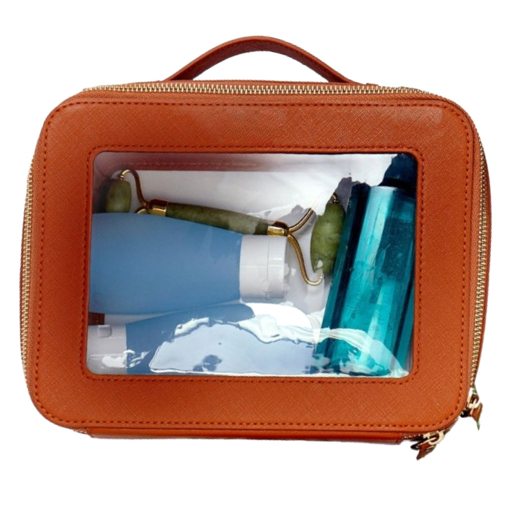 Clear leather toiletry case top view featuring transparent panels and reinforced trim