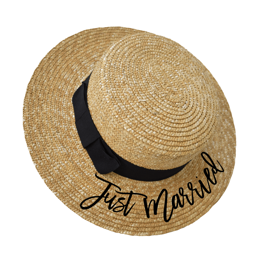 Custom Boater Hat from Sprinkled With Pink featuring natural woven straw, a classic black ribbon band, and elegant black script reading “Just Married”—a perfect bridal accessory for honeymoon getaways or destination weddings.