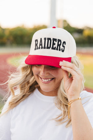 Custom collegiate vintage trucker hat in black with bold embroidered letters, perfect for gameday.