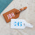 A group of leather luggage tags are customized with colorful monograms.