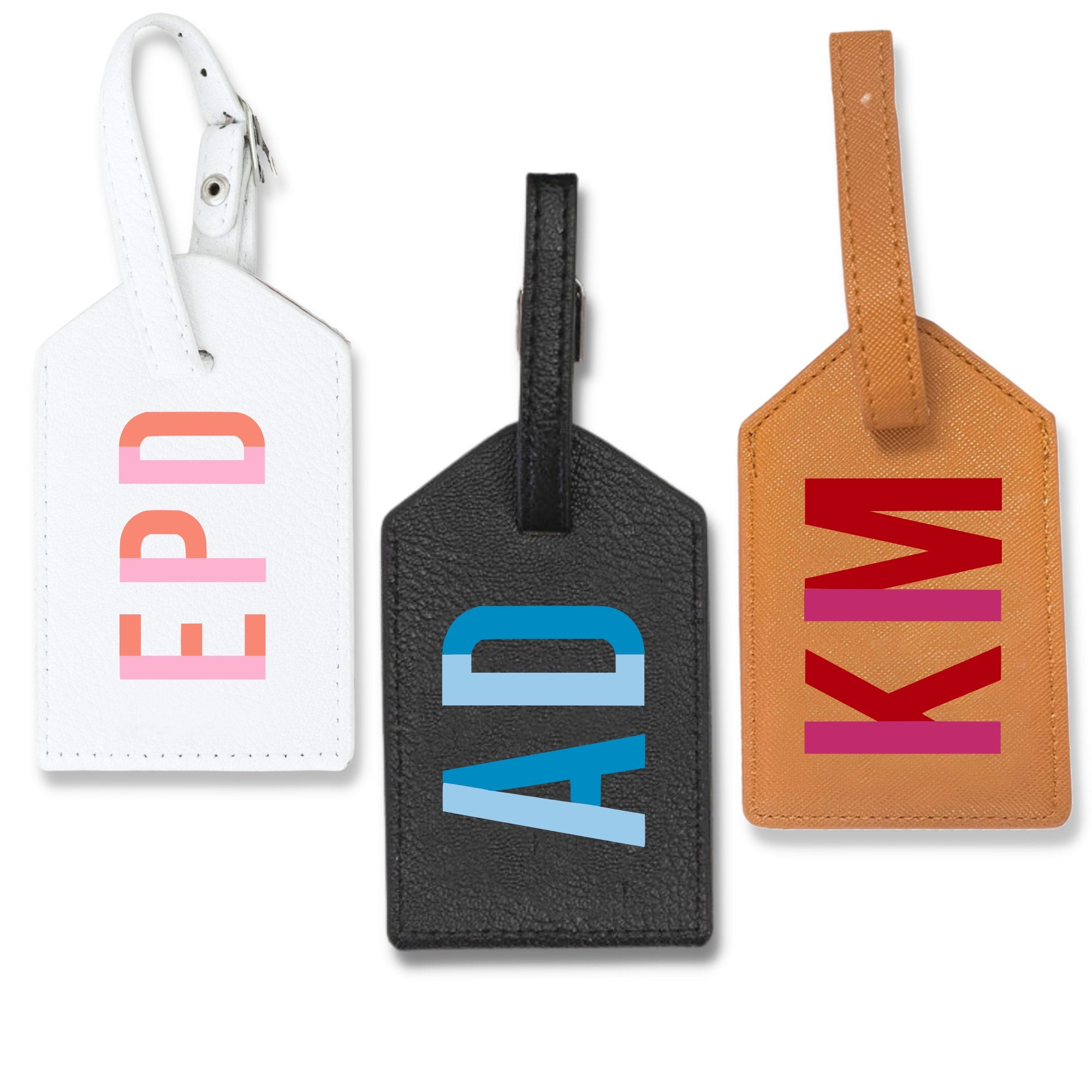 A group of leather luggage tags are customized with colorful monograms.