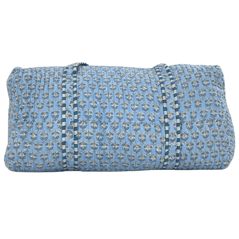 Light blue Embroidered Block Print Duffel with floral pattern, quilted fabric, and striped trim handles.