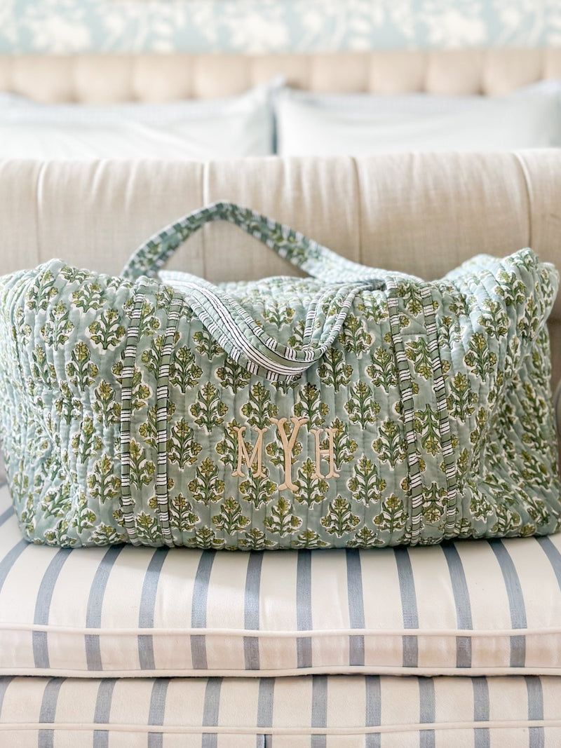 Monogrammed quilted weekender duffel bag in green print from Sprinkled With Pink, perfect for travel.