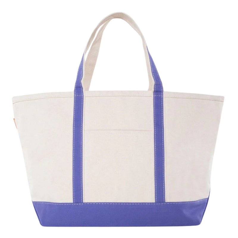 Monogrammed purple canvas tote bag with sturdy straps, personalized gifting favorite.