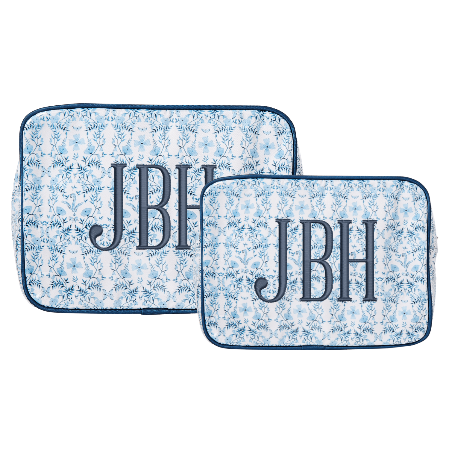 Two embroidered blue floral clear-coated pouches in large and small sizes with “JBH” monogram in bold navy letters.