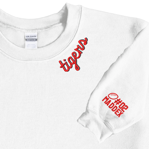 Two white sweatshirts with green and orange embroidered script on collar and sleeve