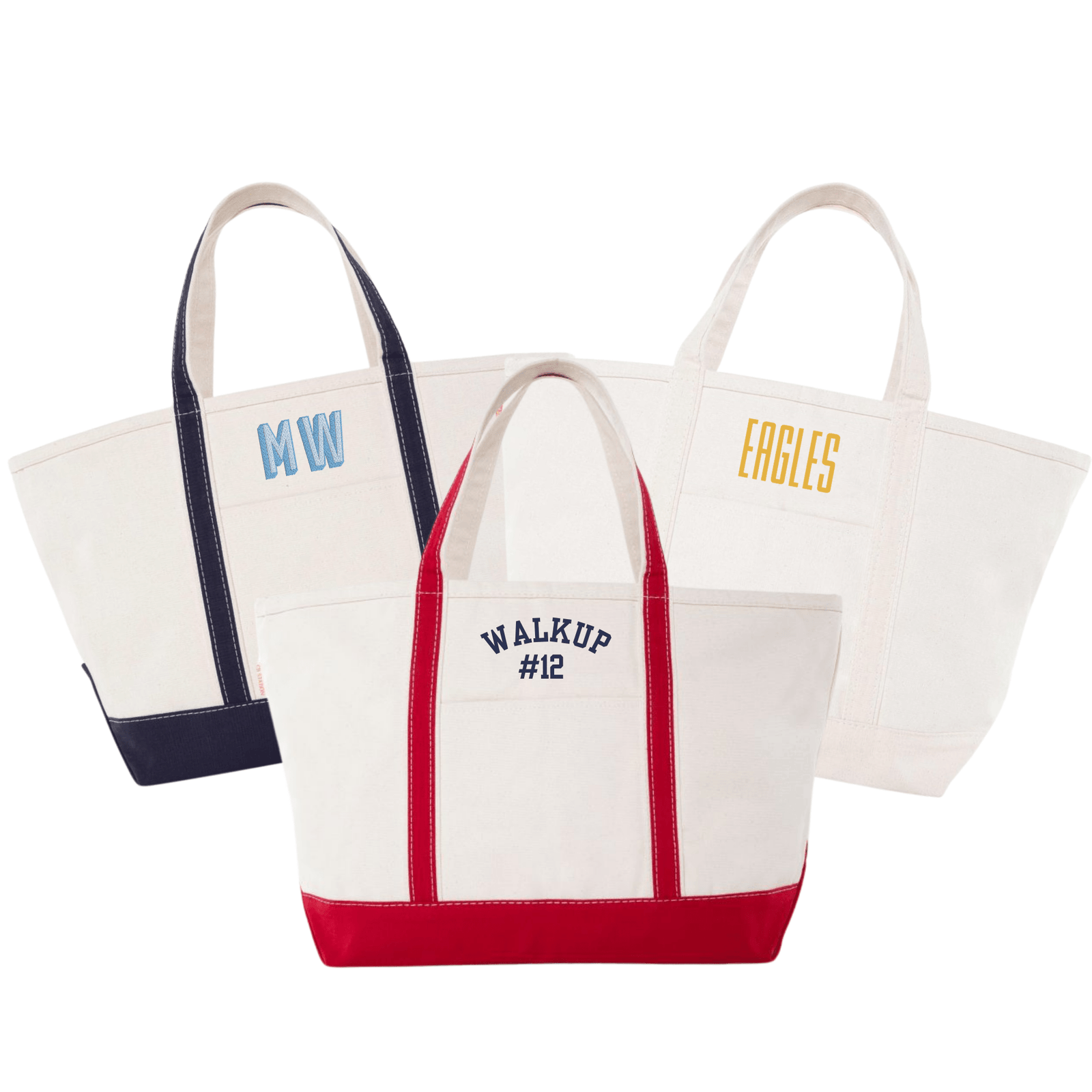 Three canvas totes with navy, red, and cream trim, embroidered with “MW,” “WALKUP #12,” or “EAGLES”