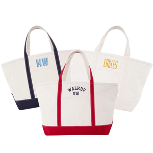 Three canvas totes with navy, red, and cream trim, embroidered with “MW,” “WALKUP #12,” or “EAGLES”