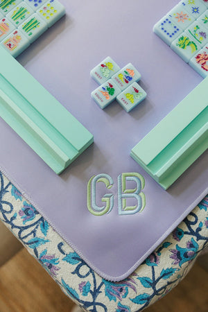 Lavender embroidered mahjong tile mat with custom monogram chic gaming table accessory.