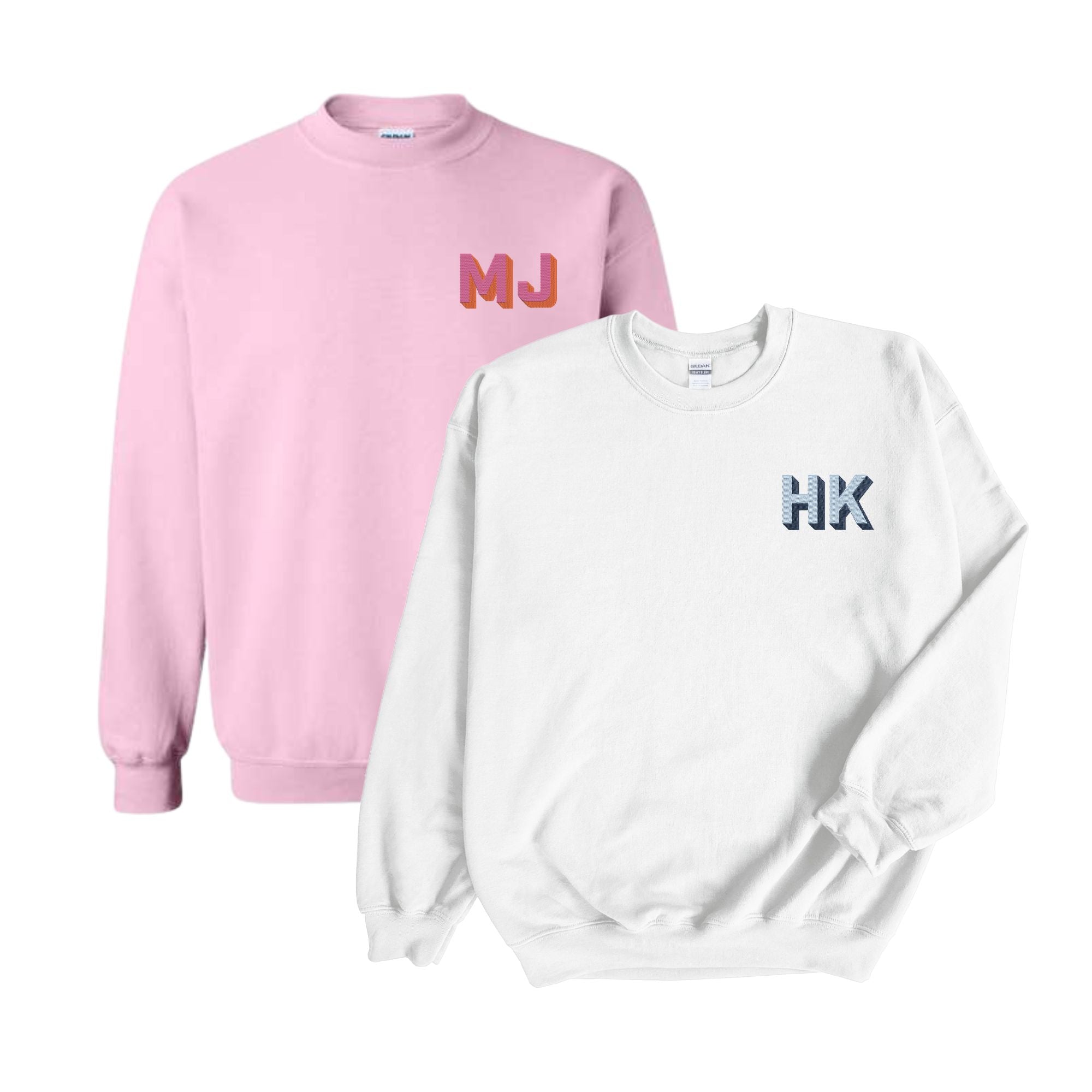 A white sweatshirt is customized with a blue embroidered monogram and a pink sweatshirt is embroidered with a pink and orange embroidered monogram.