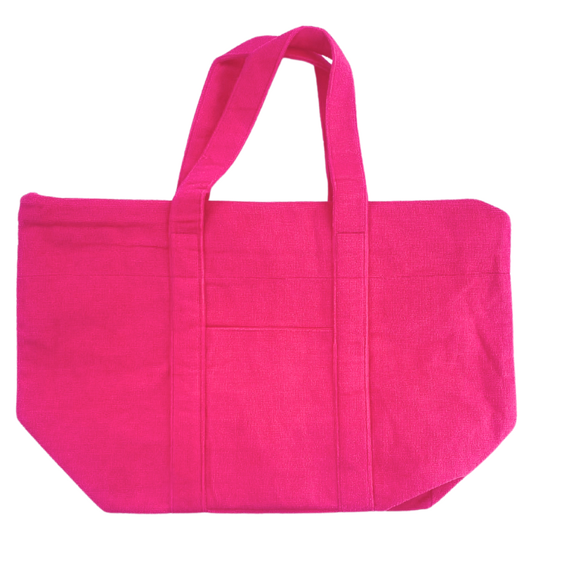 Pink terry tote bag with custom embroidery, fun and practical travel accessory.