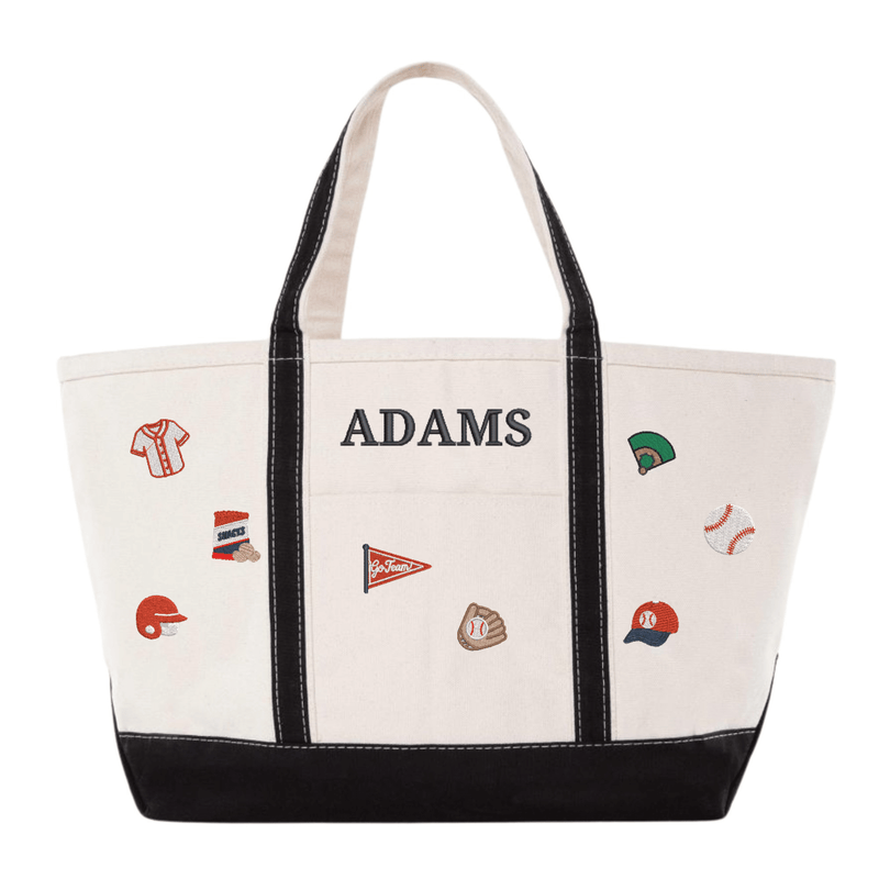 Natural canvas gameday tote with black trim embroidered "ADAMS" in black, surrounded by baseball icon embroideries: jersey, snack bag, batting helmet, pennant, mitt, baseball field, baseball, and cap
