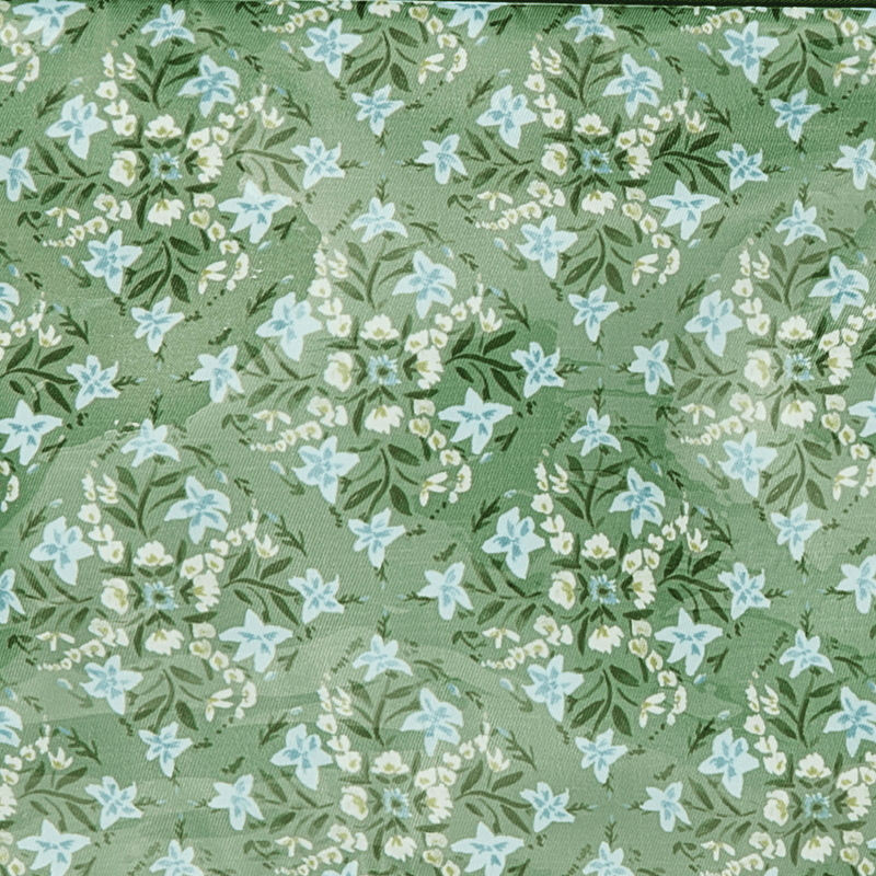 Personalized hanging toiletry bag in green floral print with monogram, ideal travel gift from Sprinkled With Pink