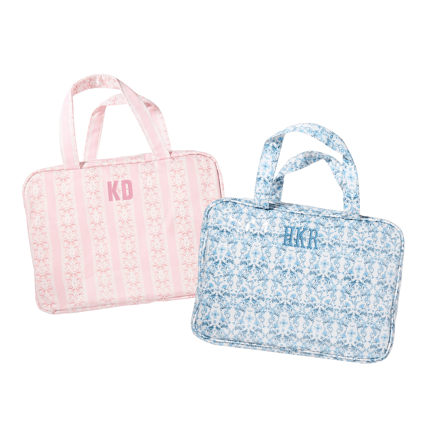 Personalized hanging toiletry bags in pink stripe and blue floral prints with monogram embroidery.