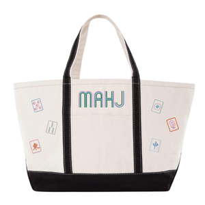 White canvas boat tote with black trim, embroidered "MAHJ" and colorful mahjong tile icon patches