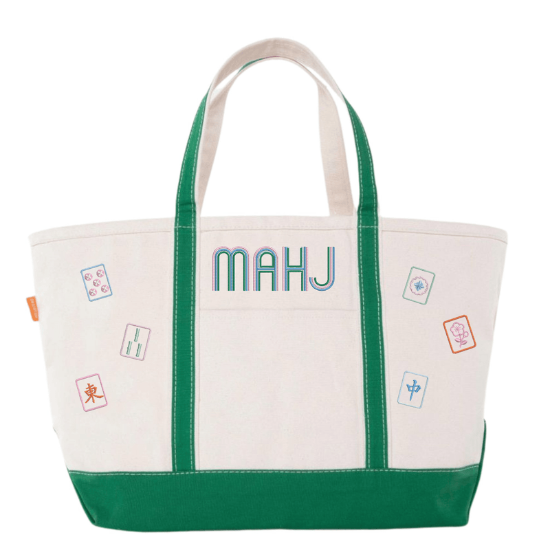 White canvas boat tote with green trim, embroidered "MAHJ" and colorful mahjong tile icon patches