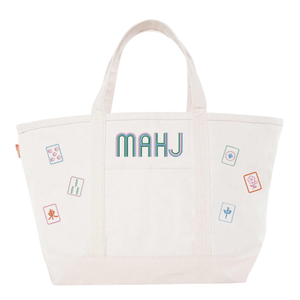 White canvas boat tote with ivory trim, embroidered "MAHJ" and colorful mahjong tile icon patches