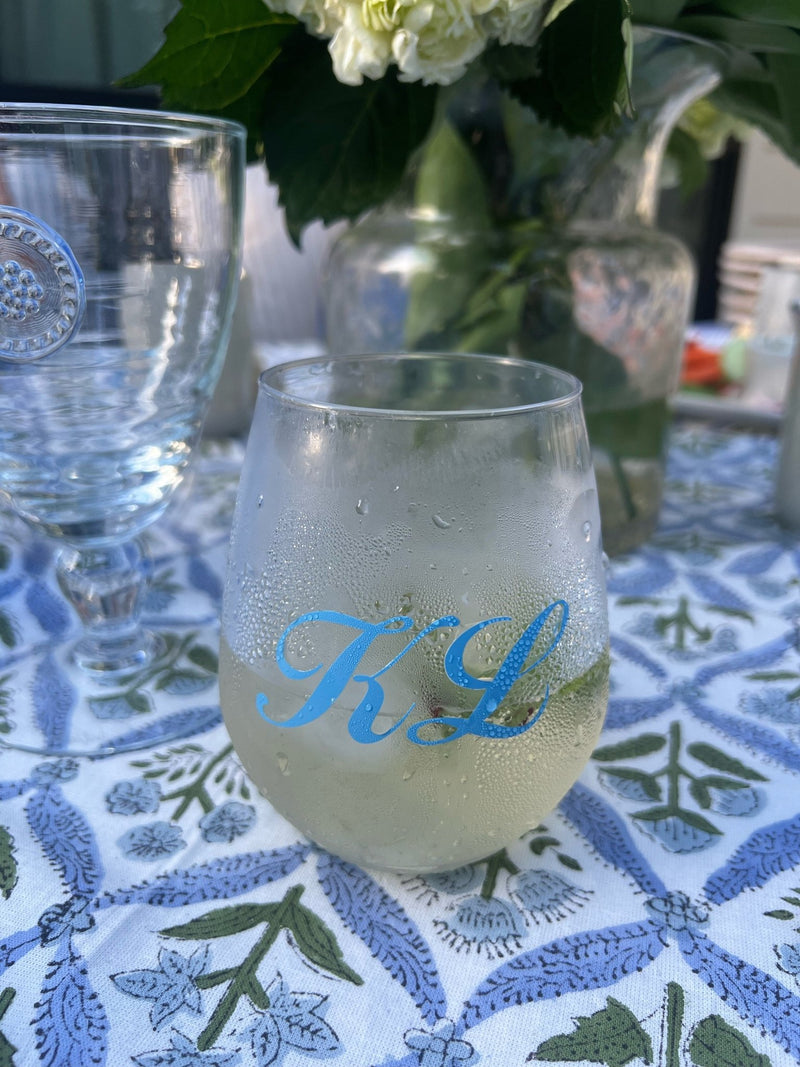 Custom Monogrammed Stemless Wine Glass (Set of 4) from Sprinkled With Pink, shown here with a frosted finish and blue script initials "KL"—a chic and personalized drinkware option ideal for outdoor entertaining, gifting, or bridal celebrations.