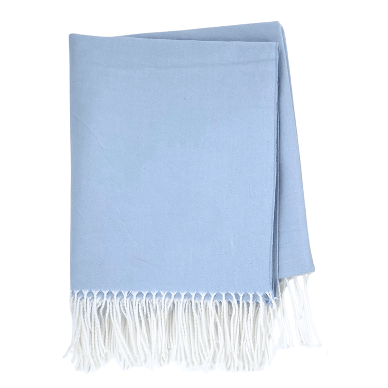 Simple folded light blue Monogrammed Woven Blanket with white fringe detailing, ready for customization
